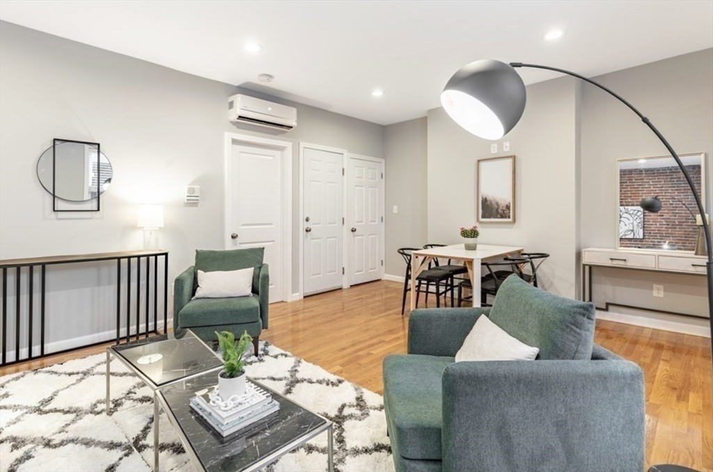 353 Sumner Street, Unit 1 Boston, MA 02128 - Photo 5 of 23 a living room with furniture and wooden floor