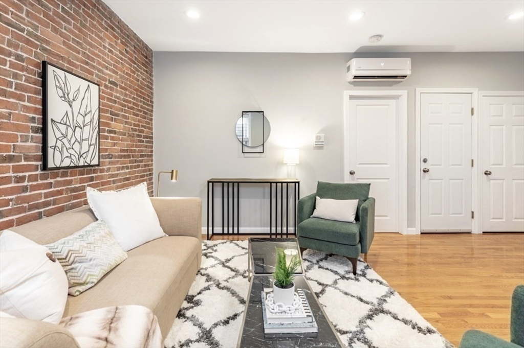 353 Sumner Street, Unit 1 Boston, MA 02128 - Photo 6 of 23 a bedroom with furniture and a window