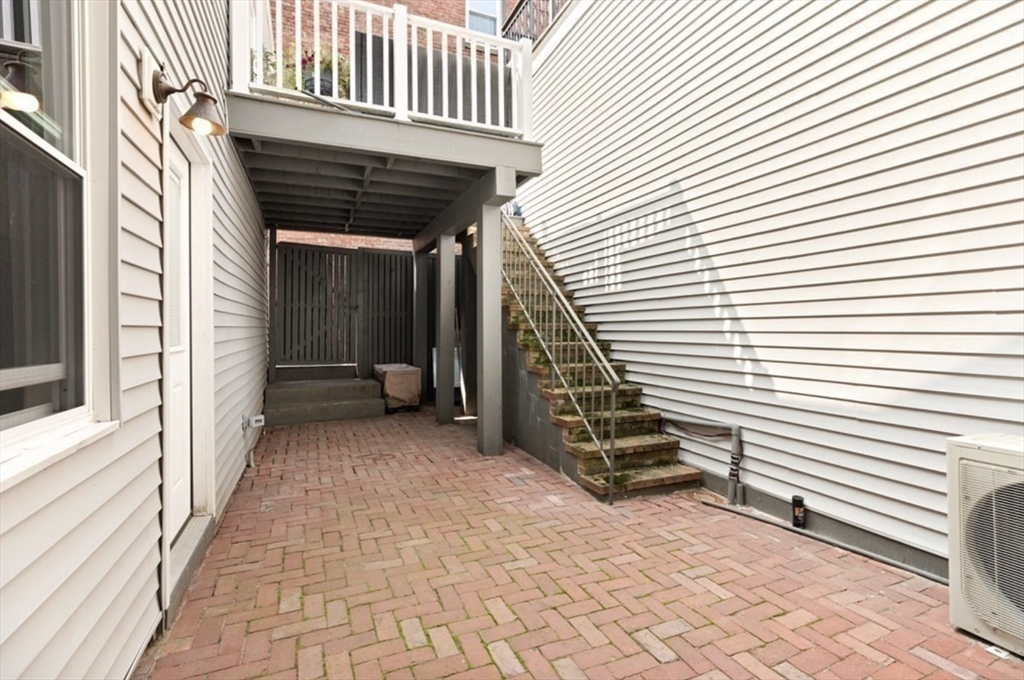 353 Sumner Street, Unit 1 Boston, MA 02128 - Photo 10 of 23 a view of a pathway with a balcony