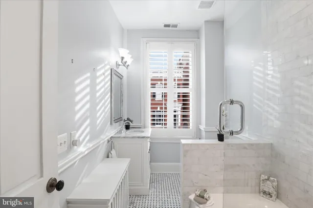 a bathroom with a tub and shower