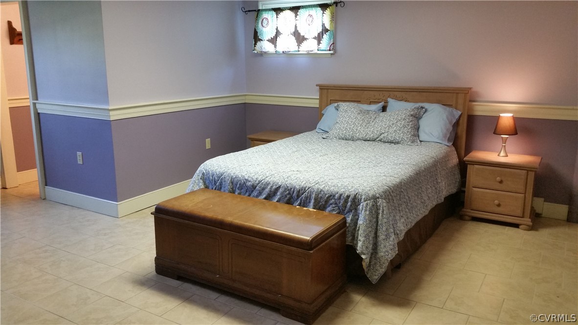 5374 Crumptown Road Farmville, VA 23901 - Photo 17 of 26 a bedroom with a bed and a window