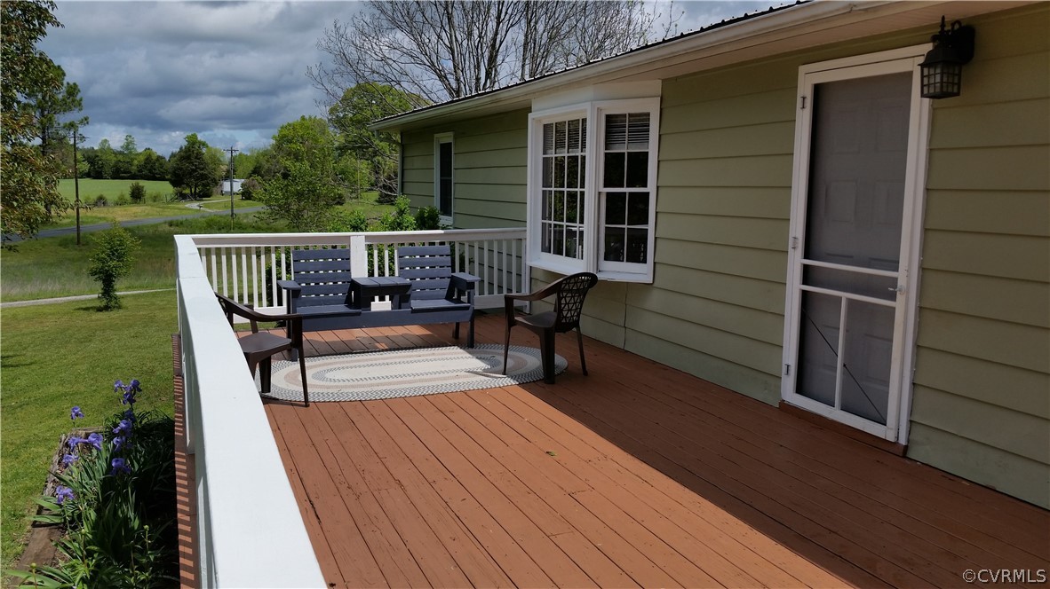 5374 Crumptown Road Farmville, VA 23901 - Photo 19 of 26 a view of balcony with deck and outdoor seating