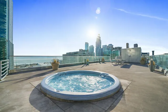 a view of a swimming pool and a yard