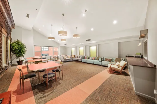 a room with gym equipment and a large window