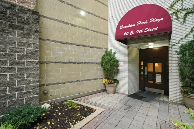 a view of a brick wall with an outdoor space