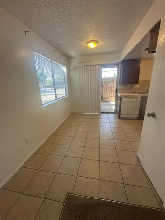 a view of a livingroom with furniture and window