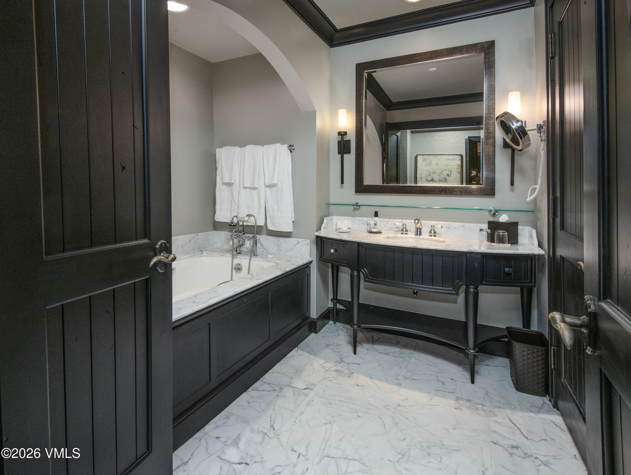 130 Daybreak Ridge Road, Unit HS716 Avon, CO 81620 - Photo 11 of 25 a bathroom with a sink and a mirror