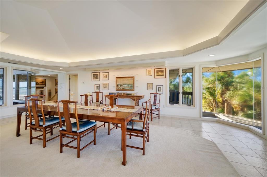 1198 Mandalay Point Road Clearwater, FL 33767 - Photo 17 of 61 a dining room with furniture and wooden floor