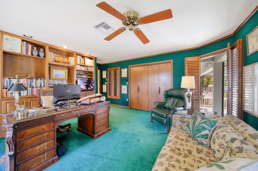 1198 Mandalay Point Road Clearwater, FL 33767 - Photo 27 of 61 a work room with furniture and a ceiling fan