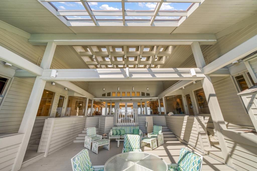 1198 Mandalay Point Road Clearwater, FL 33767 - Photo 32 of 61 a view of a porch with seating area