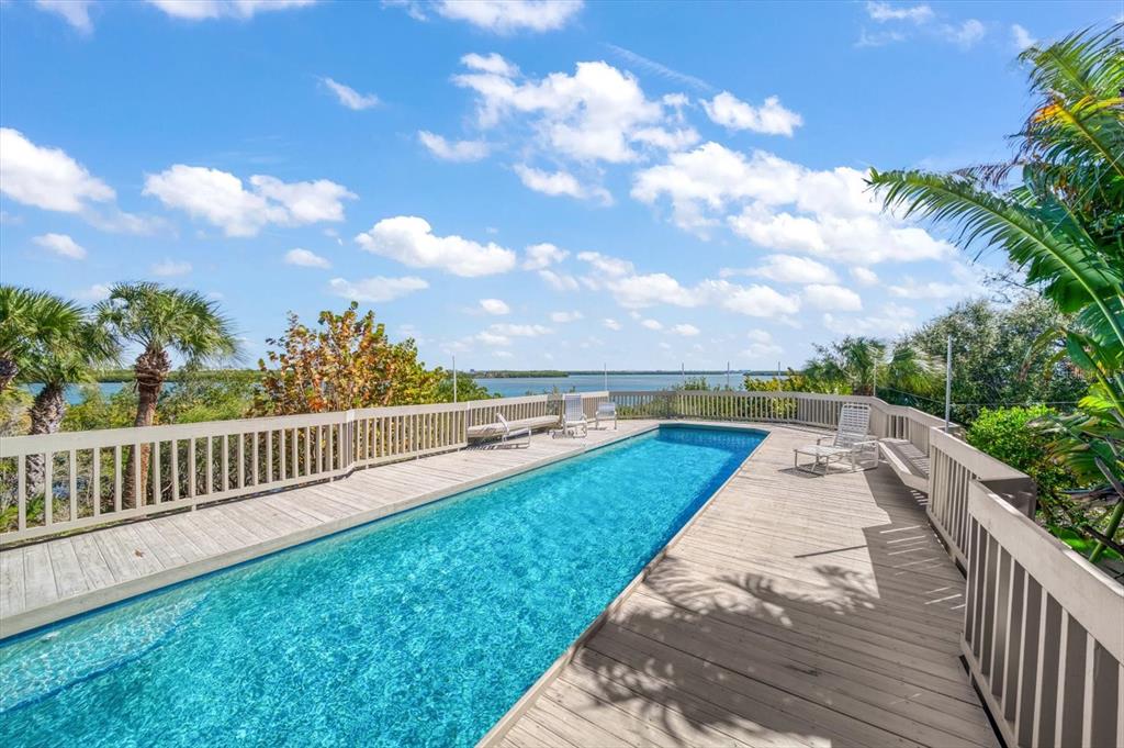 1198 Mandalay Point Road Clearwater, FL 33767 - Photo 36 of 61 a view of a garden with wooden floor
