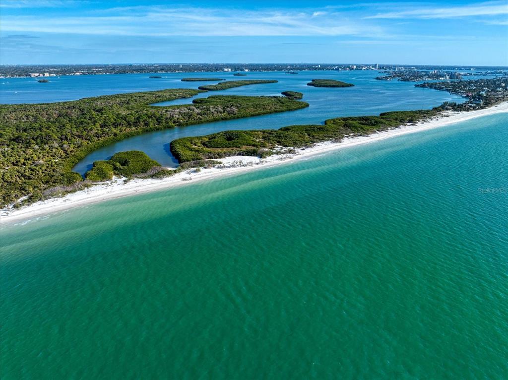 1198 Mandalay Point Road Clearwater, FL 33767 - Photo 47 of 61 a view of an ocean and beach