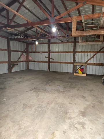 a view of a room with wooden ceiling
