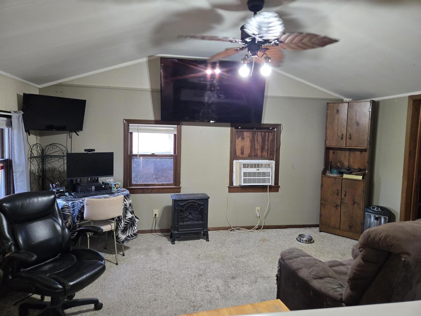 930 42nd Street New Boston, IL 61272 - Photo 4 of 22 a living room with furniture and a flat screen tv