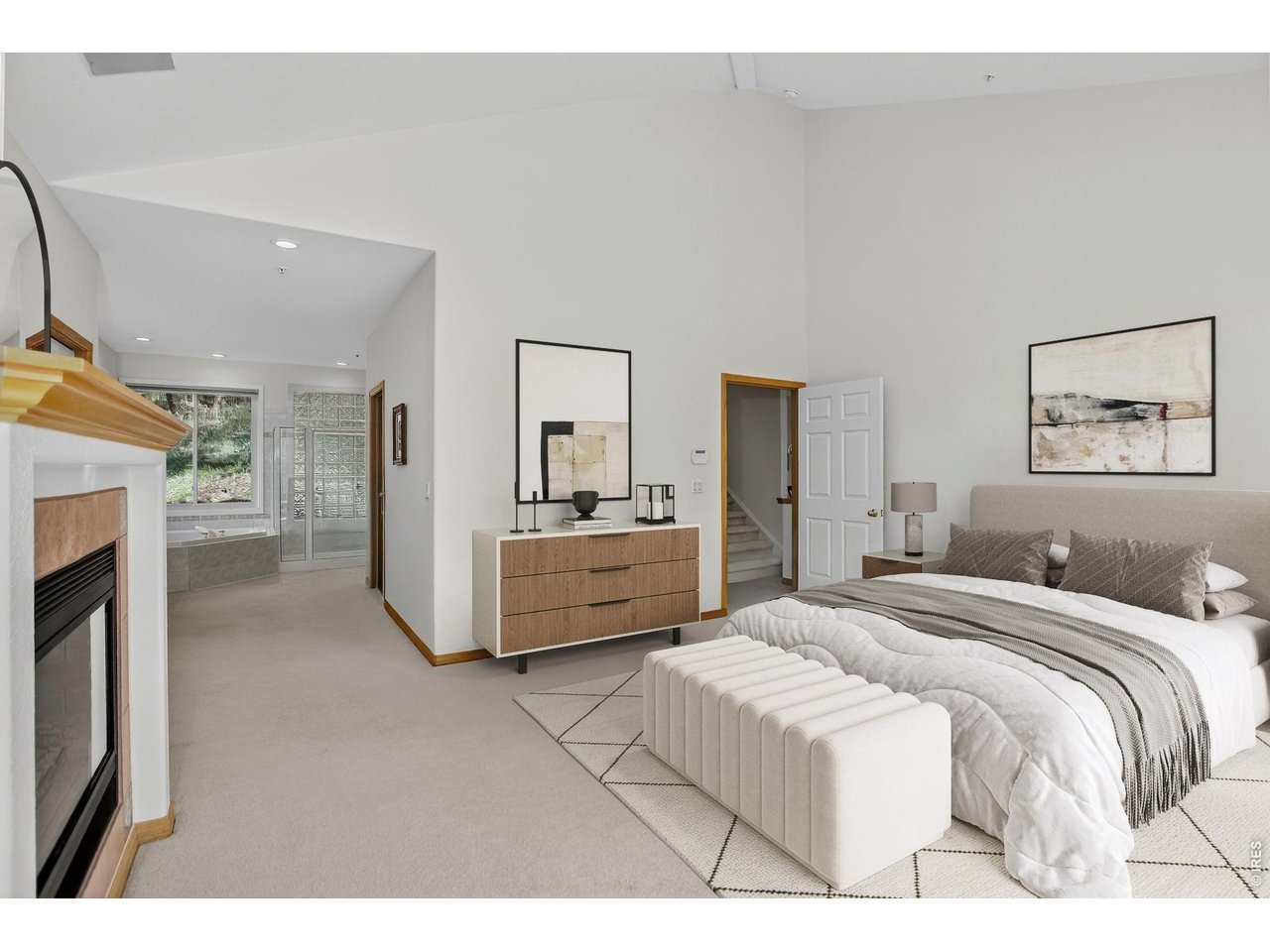 65 Betasso Road Boulder, CO 80302 - Photo 22 of 38 a spacious bedroom with a bed and a couch