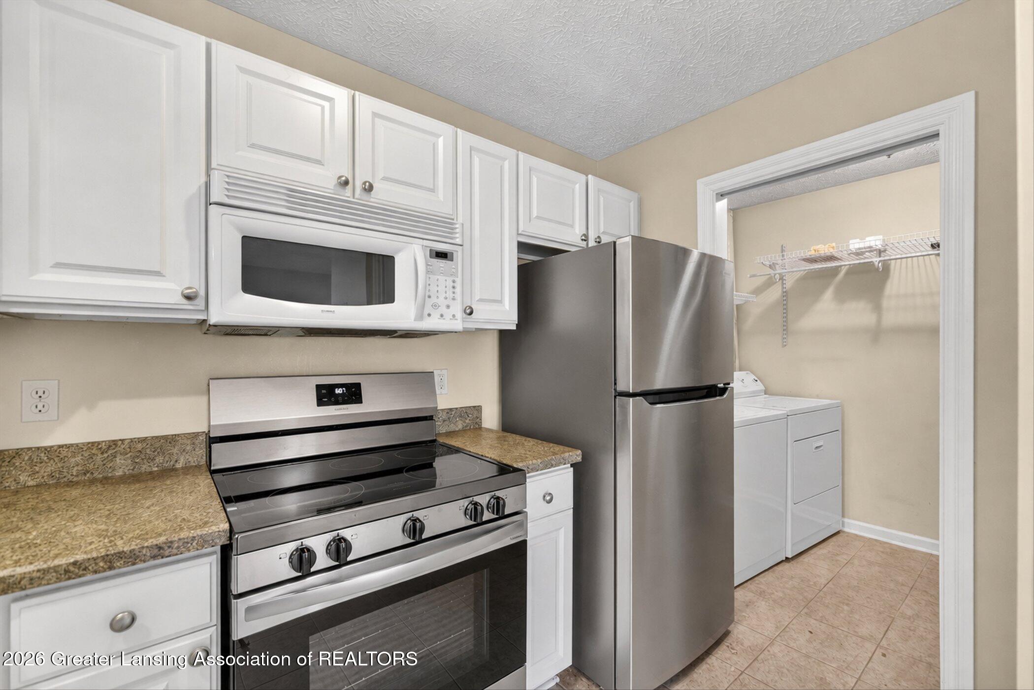 1337 Coolidge Road, Unit 16 East Lansing, MI 48823 - Photo 11 of 31 11-1337-Coolidge-Rd-WindowStill