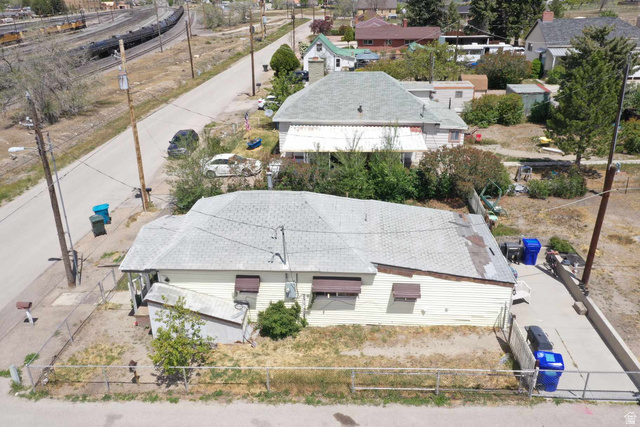 399 2nd E Street Helper, UT 84526 - Photo 14 of 19 Single-story residence featuring light-colored siding and a composition shingle roof