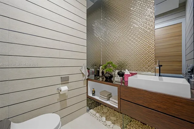 a bedroom with a bed and a wall painting