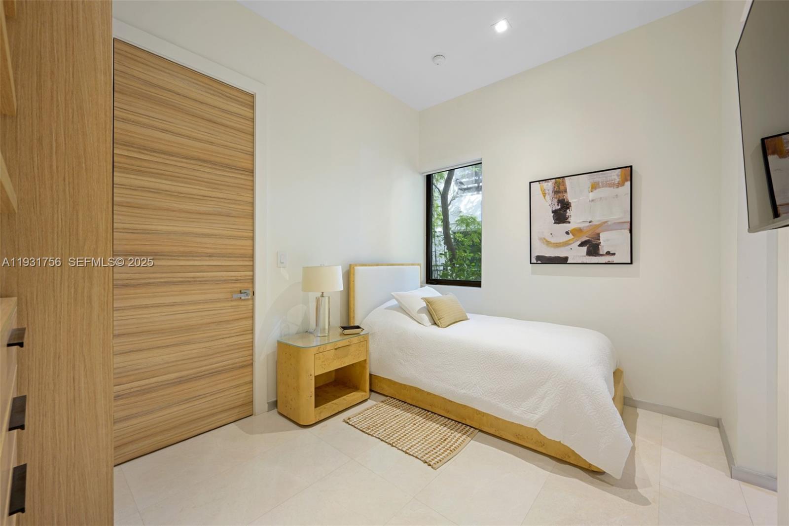 3260 Northeast 165th Street North Miami Beach, FL 33160 - Photo 16 of 43 a bedroom with a bed and a wall painting