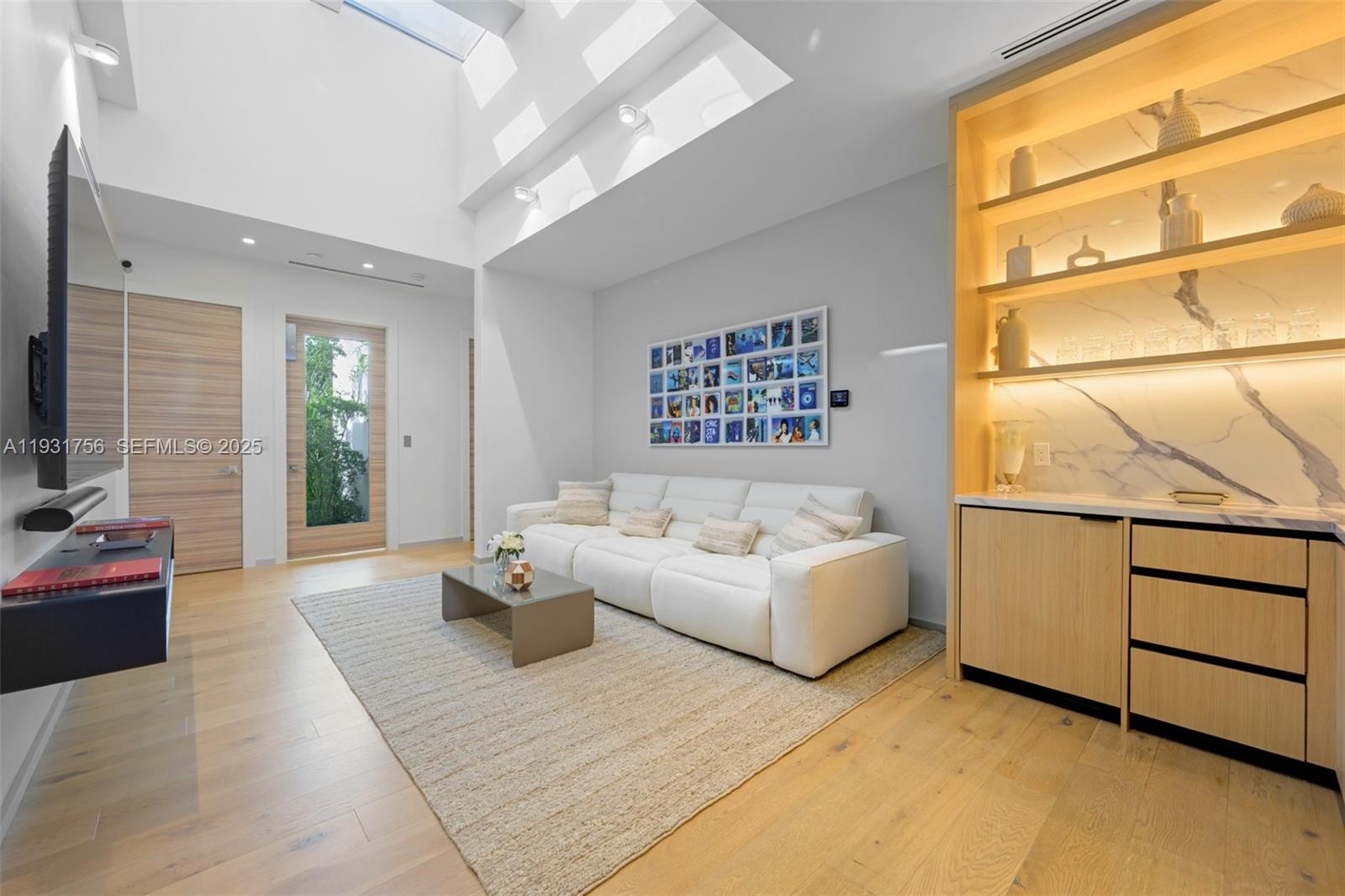 3260 Northeast 165th Street North Miami Beach, FL 33160 - Photo 18 of 43 a living room with furniture and a window