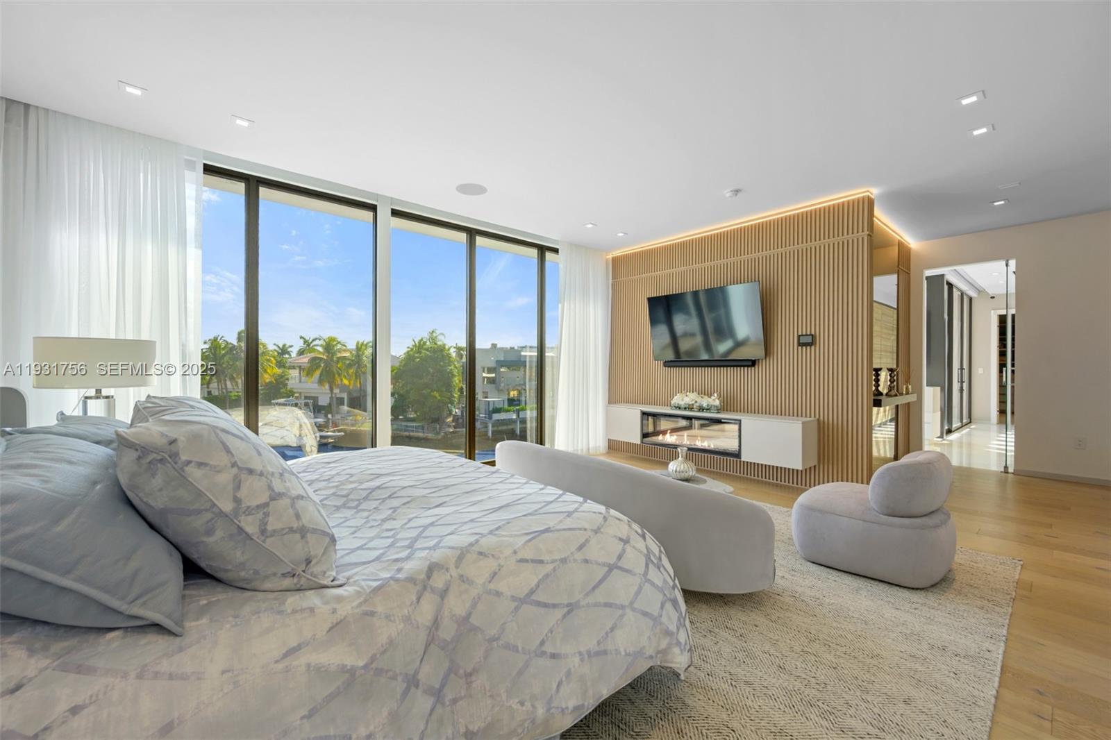 3260 Northeast 165th Street North Miami Beach, FL 33160 - Photo 20 of 43 a spacious bedroom with a large bed and a large window