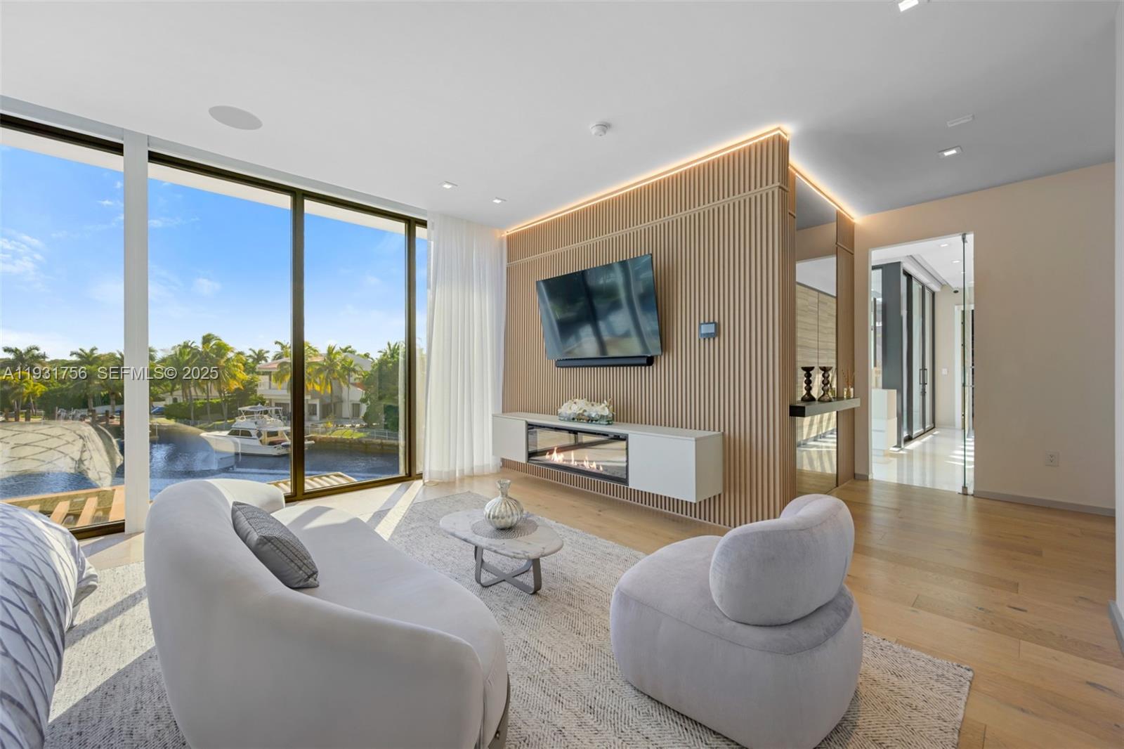 3260 Northeast 165th Street North Miami Beach, FL 33160 - Photo 21 of 43 a living room with furniture or couch and a flat screen tv