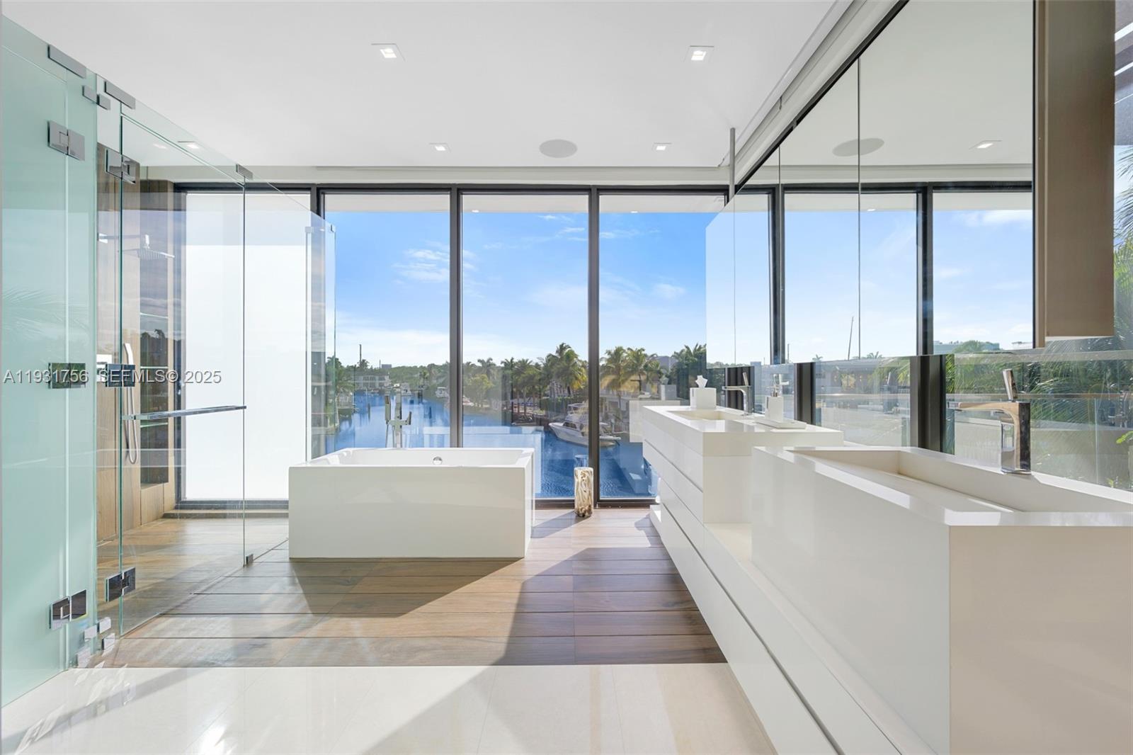 3260 Northeast 165th Street North Miami Beach, FL 33160 - Photo 23 of 43 a living room with large windows and a table