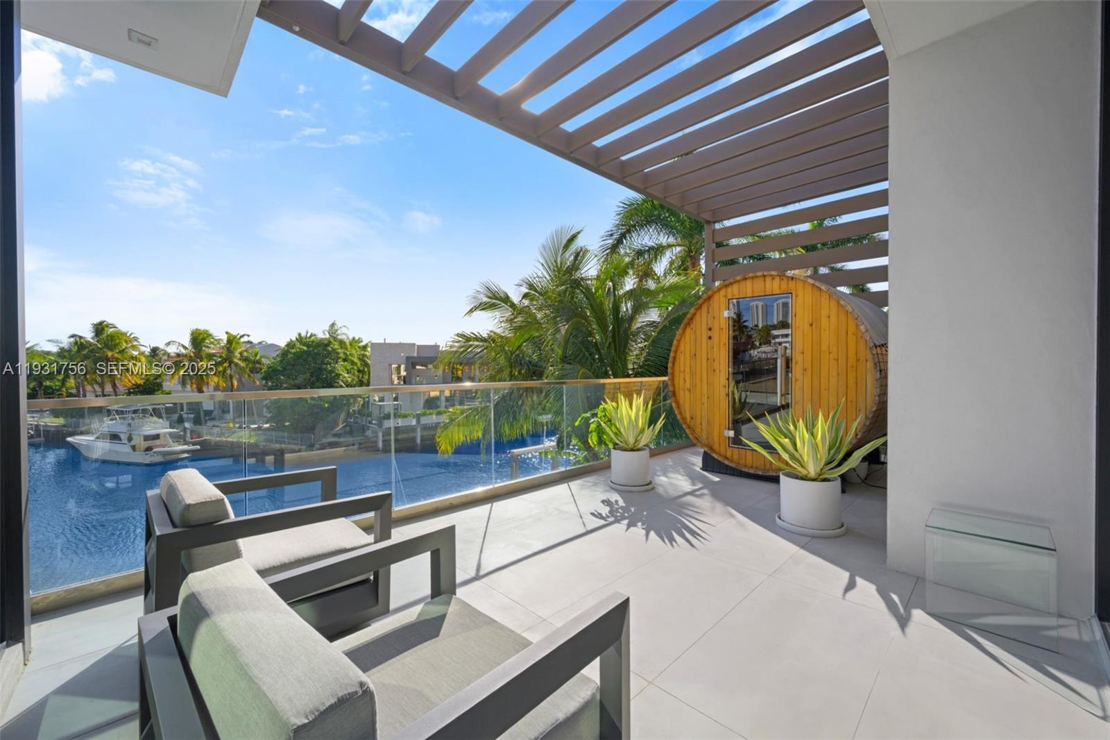 3260 Northeast 165th Street North Miami Beach, FL 33160 - Photo 25 of 43 a view of a chairs and table in the balcony