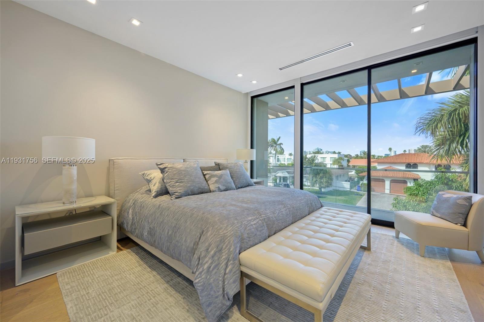 3260 Northeast 165th Street North Miami Beach, FL 33160 - Photo 26 of 43 a bedroom with a bed and a couch