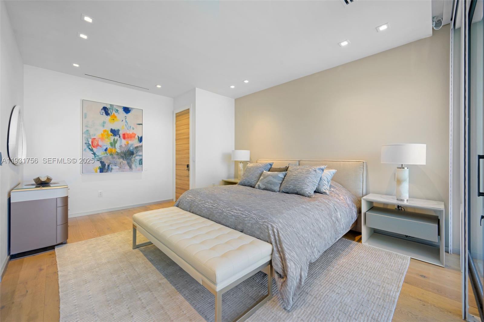 3260 Northeast 165th Street North Miami Beach, FL 33160 - Photo 27 of 43 a spacious bedroom with a bed and a couch