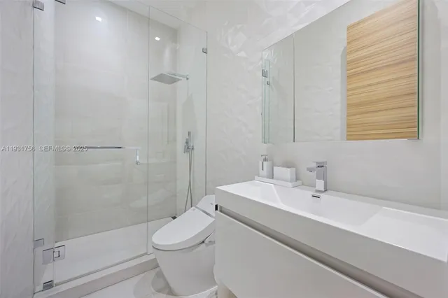 a spacious bedroom with a large bed and a large window