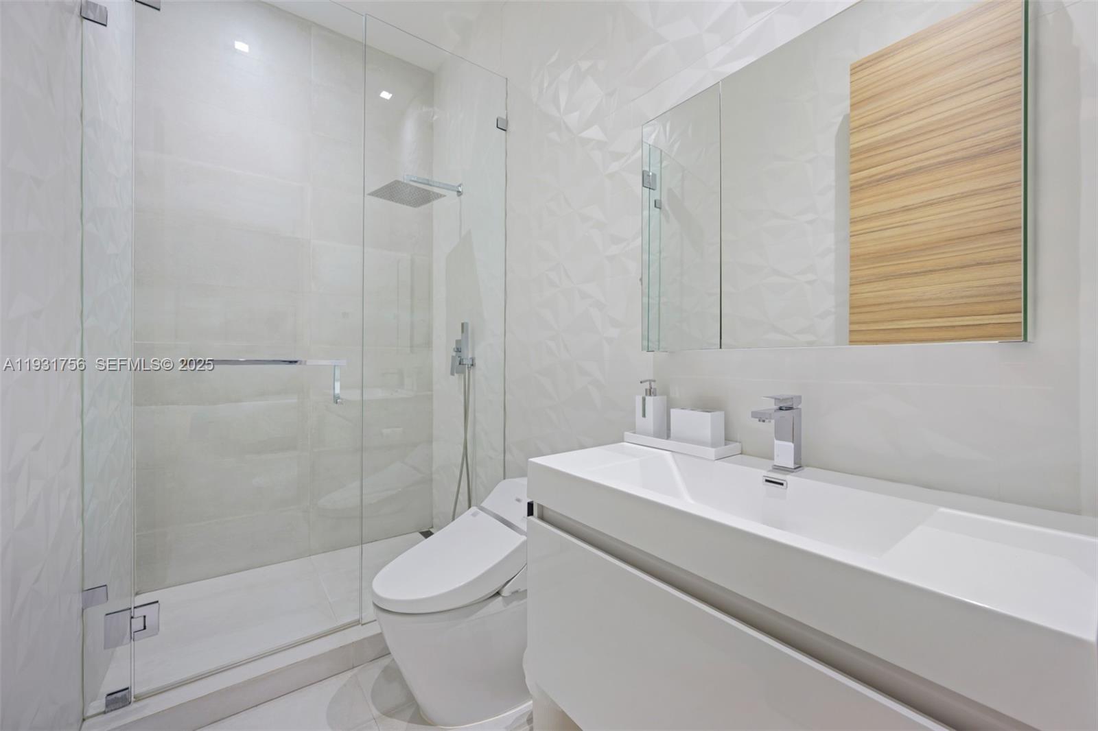 3260 Northeast 165th Street North Miami Beach, FL 33160 - Photo 28 of 43 a bathroom with a sink toilet and shower