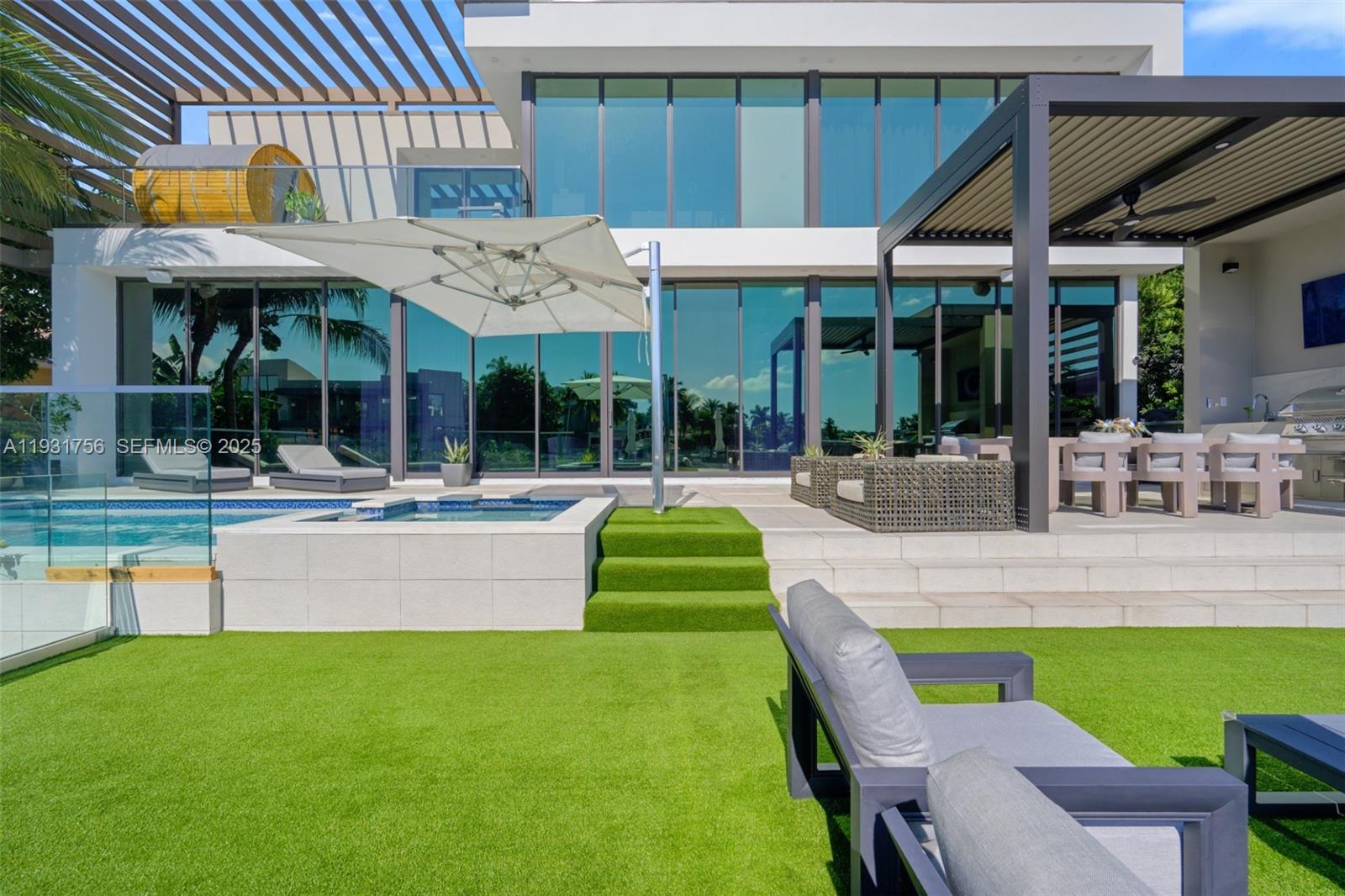 3260 Northeast 165th Street North Miami Beach, FL 33160 - Photo 3 of 43 a view of outdoor space yard deck patio and swimming pool