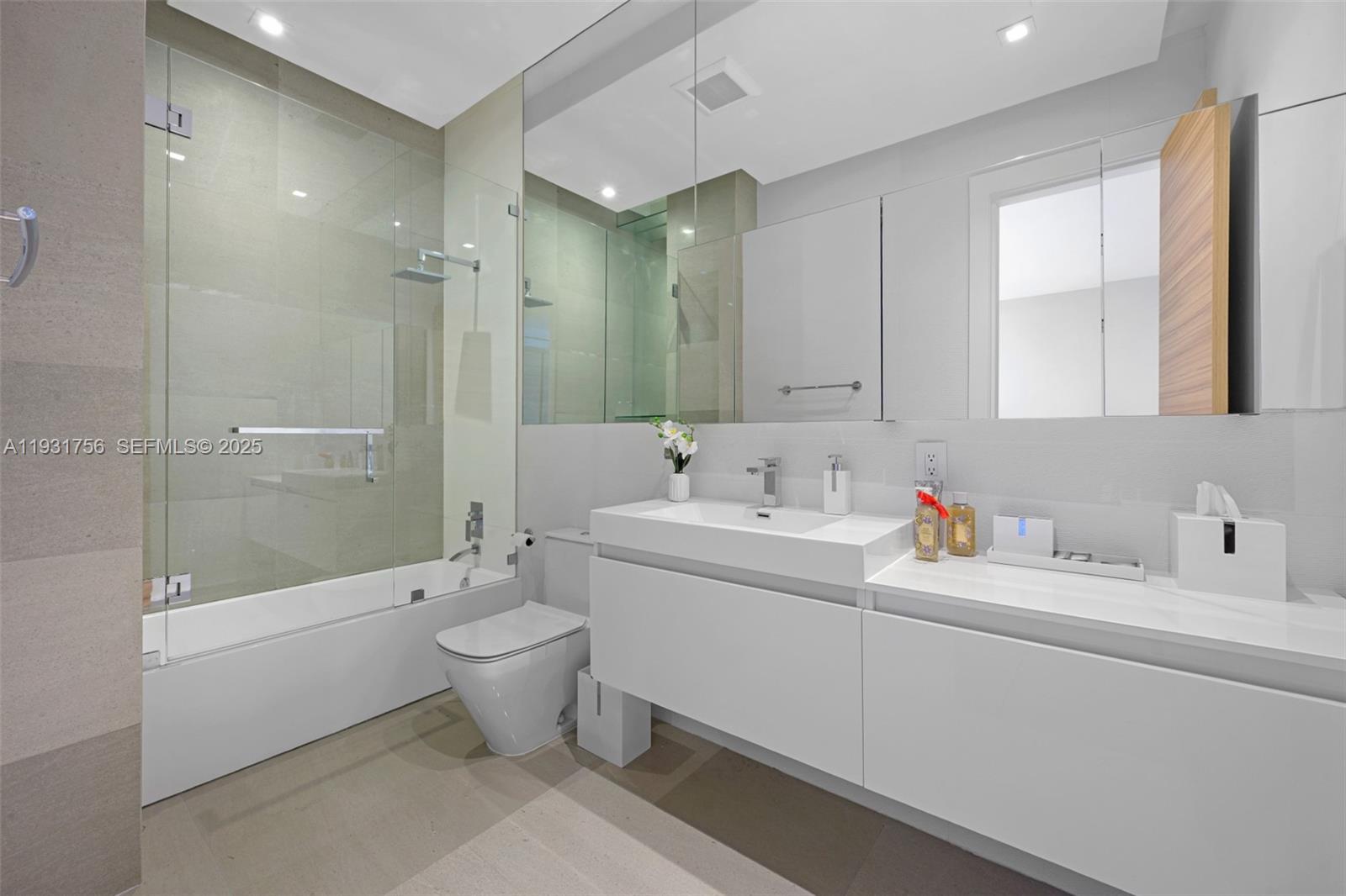 3260 Northeast 165th Street North Miami Beach, FL 33160 - Photo 32 of 43 a bathroom with a sink toilet and shower