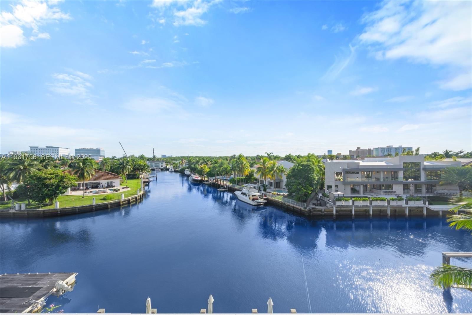 3260 Northeast 165th Street North Miami Beach, FL 33160 - Photo 33 of 43 a view of a lake with lawn chairs