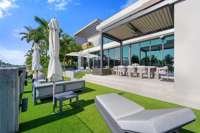 a view of a patio with couches chairs and a table