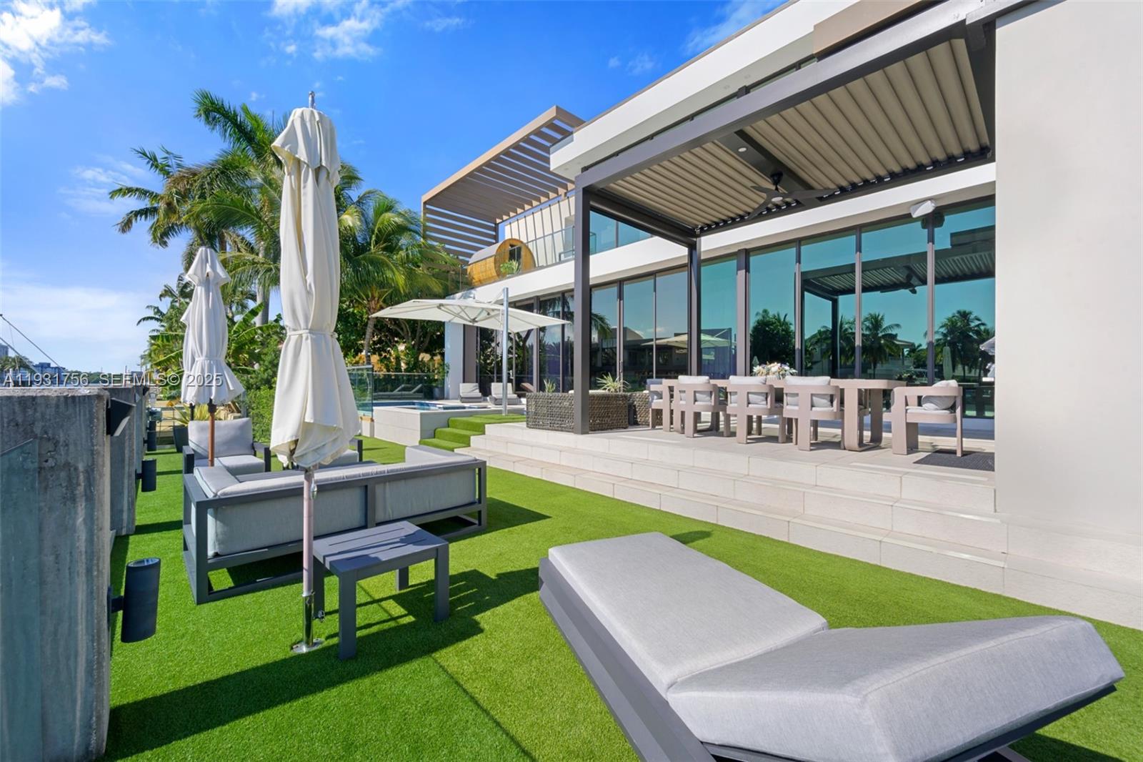 3260 Northeast 165th Street North Miami Beach, FL 33160 - Photo 40 of 43 a view of outdoor space yard deck patio and swimming pool