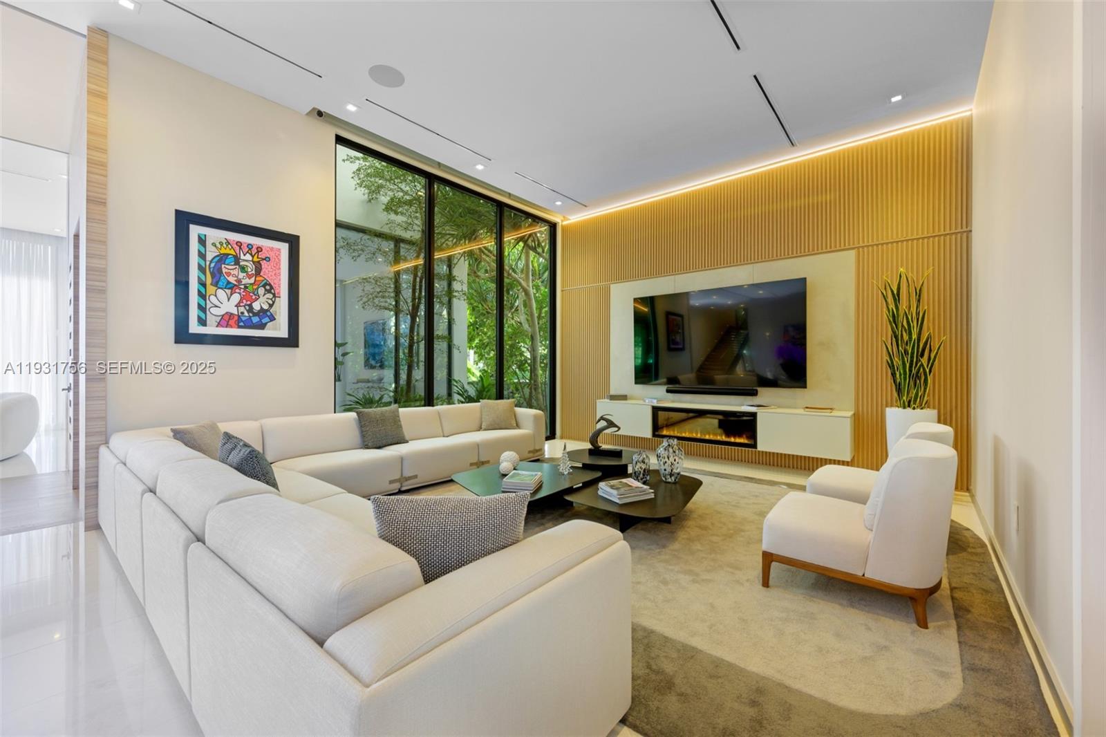 3260 Northeast 165th Street North Miami Beach, FL 33160 - Photo 5 of 43 a living room with furniture and a flat screen tv