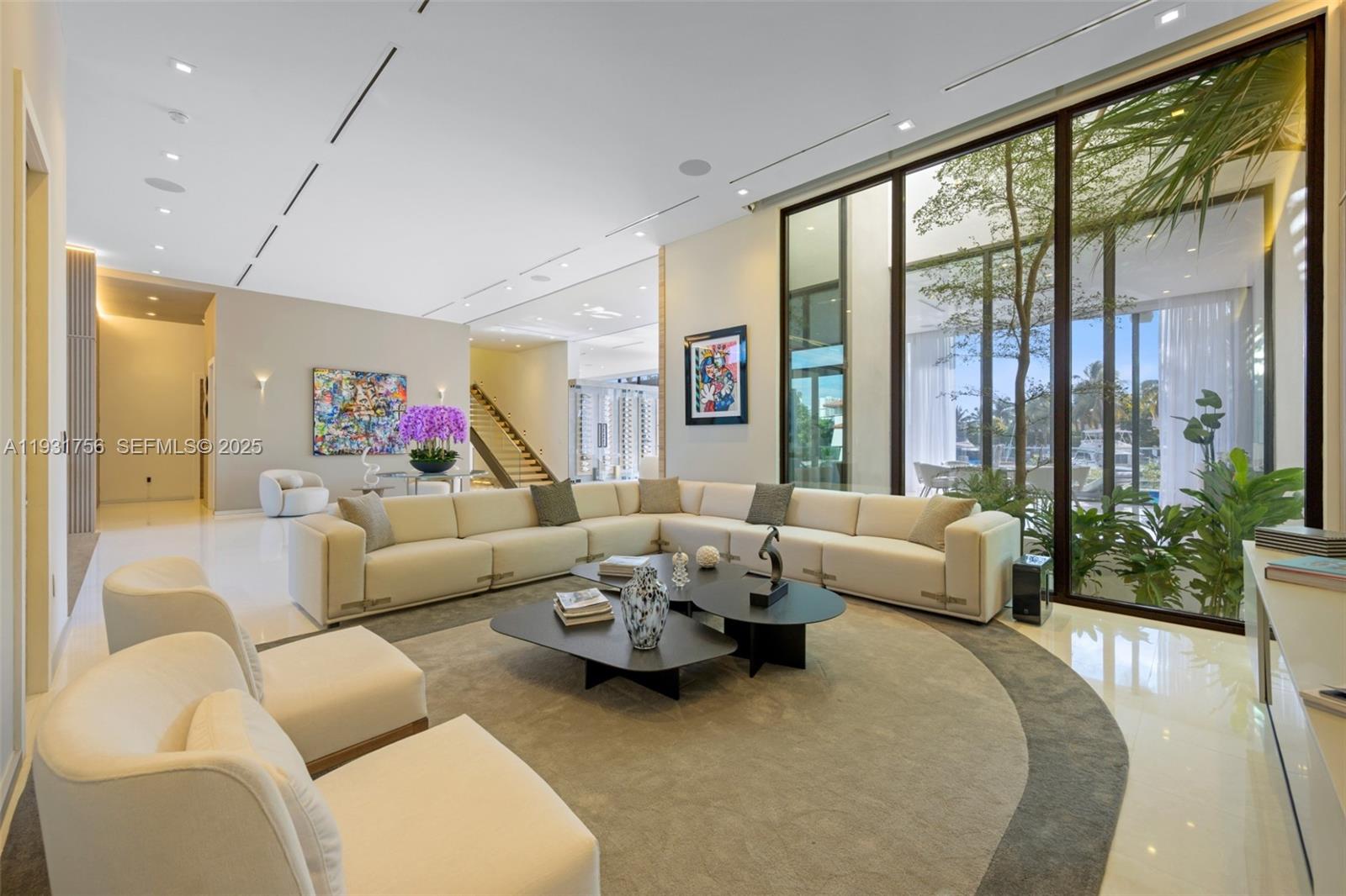 3260 Northeast 165th Street North Miami Beach, FL 33160 - Photo 6 of 43 a living room with furniture and a large window