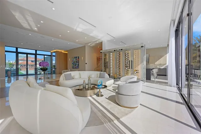 a living room with couch and a large window