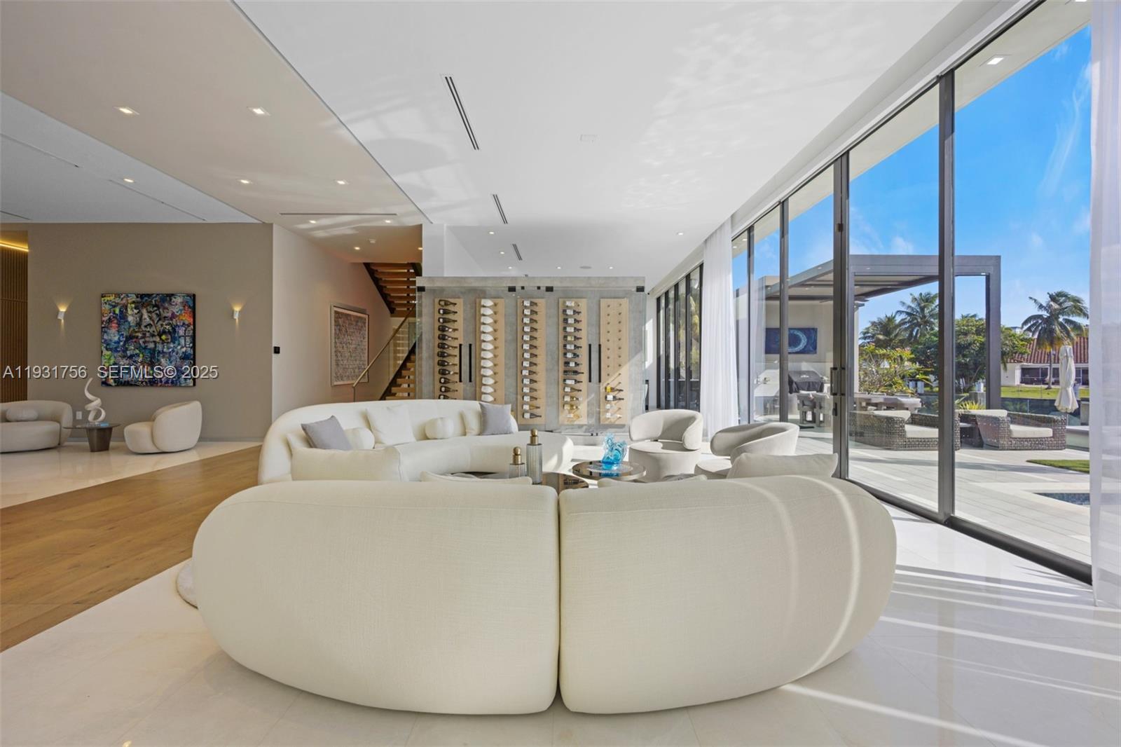 3260 Northeast 165th Street North Miami Beach, FL 33160 - Photo 10 of 43 a living room with couch and a large window