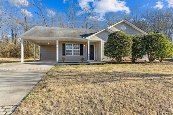 front view of a house with a yard