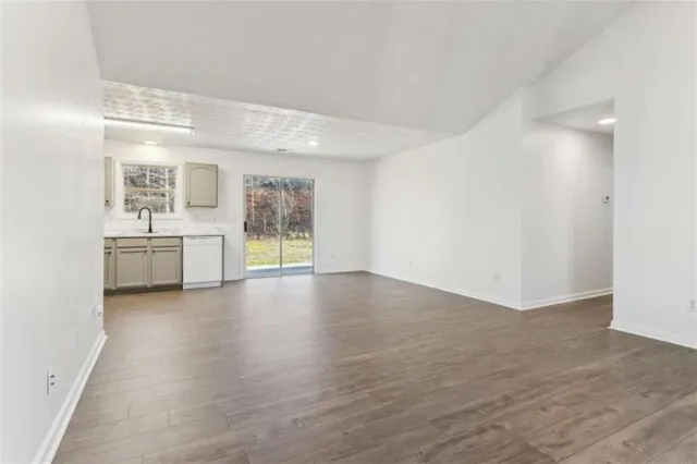 a view of a kitchen with a sink and a window