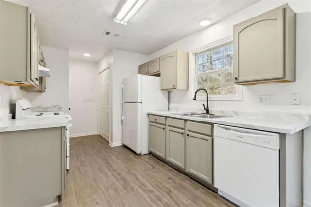 a bathroom with a sink double vanity granite and a mirror