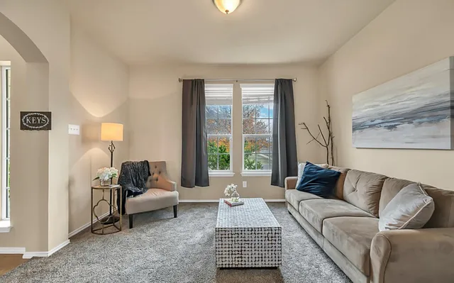 a bedroom with a bed dresser and a flat screen tv
