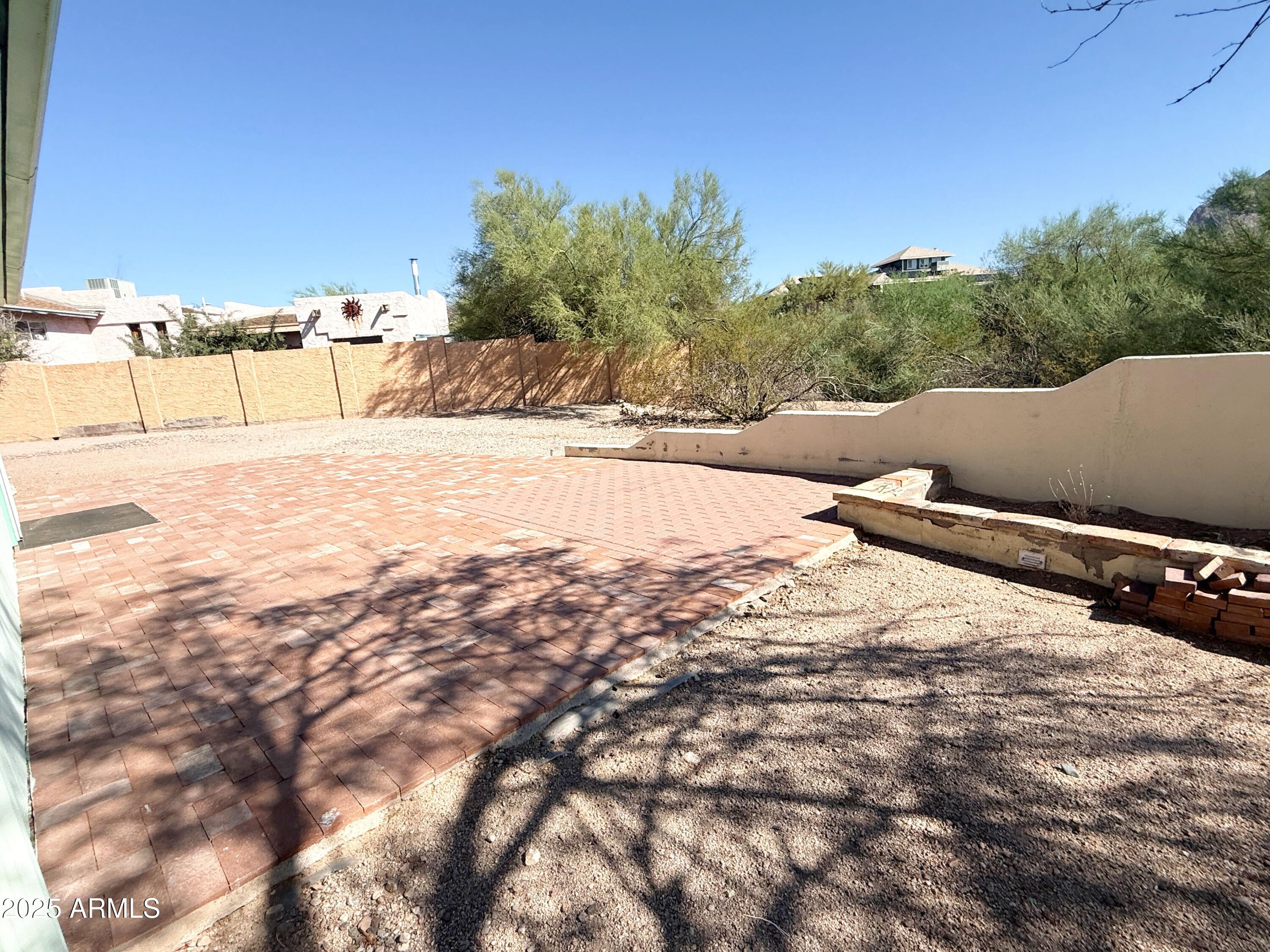 867 North Arroya Road Apache Junction, AZ 85119 - Photo 18 of 19 a view of a yard with snow on the road