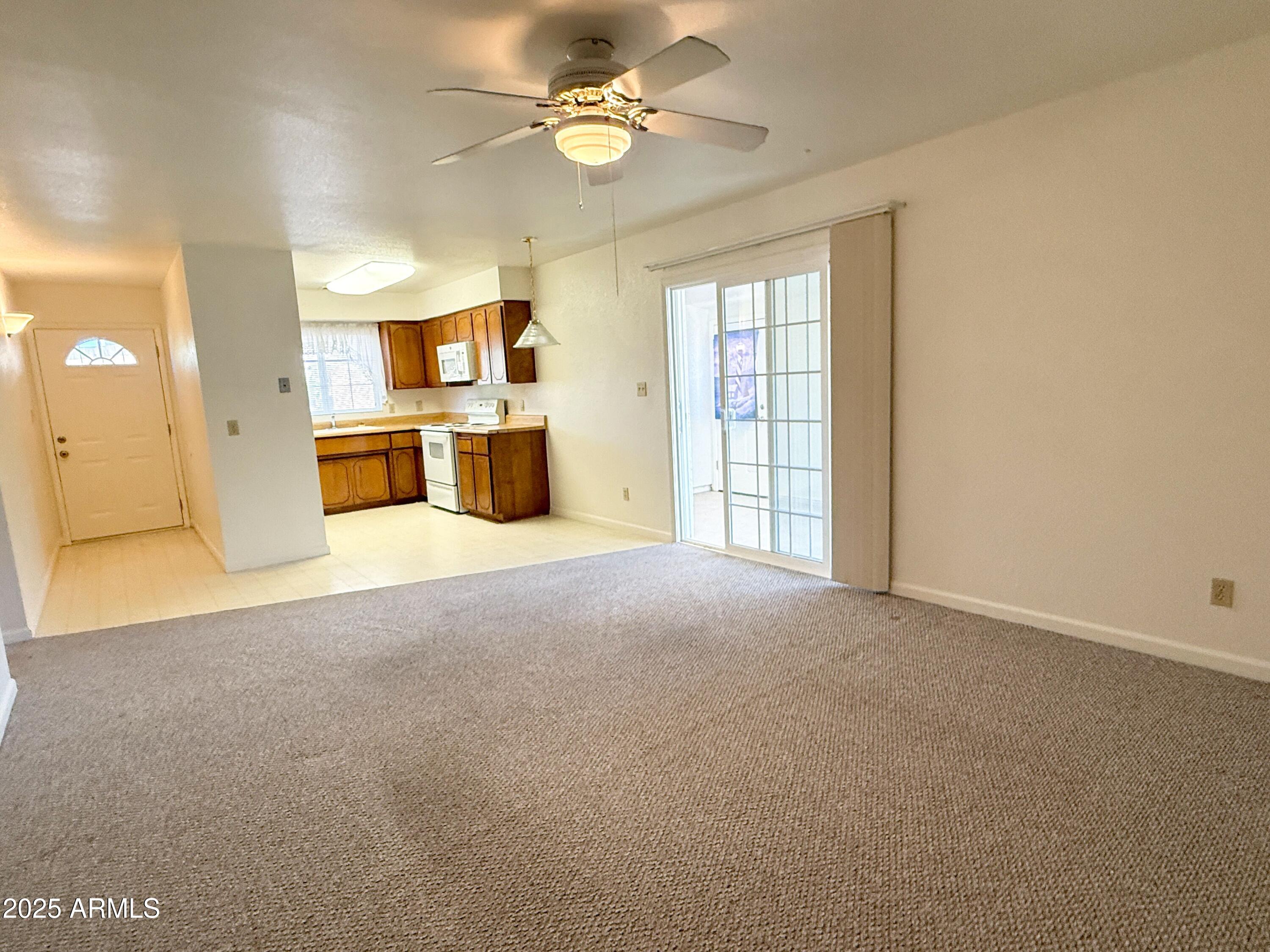 867 North Arroya Road Apache Junction, AZ 85119 - Photo 6 of 19 a view of a kitchen with a sink and a window