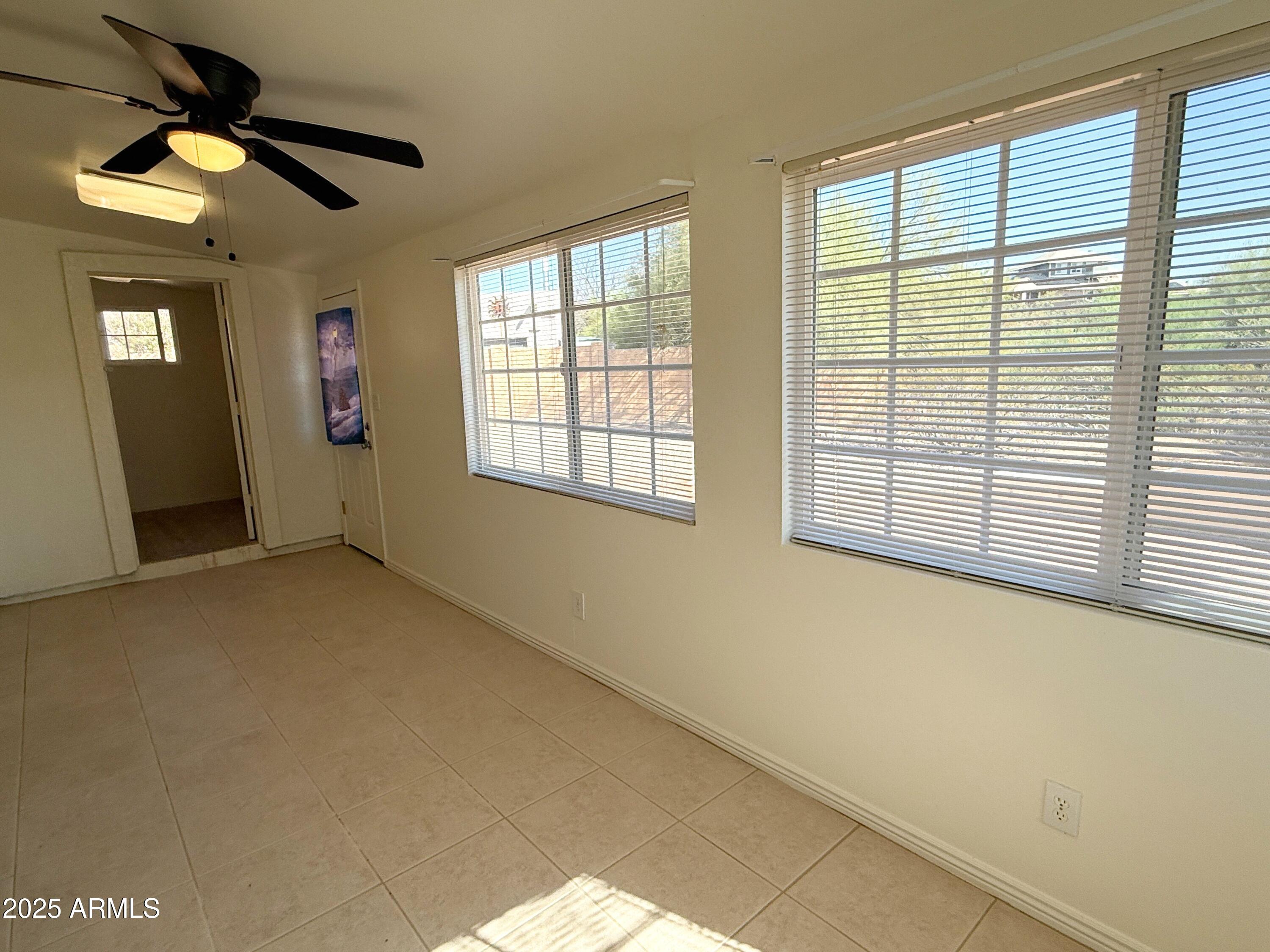 867 North Arroya Road Apache Junction, AZ 85119 - Photo 10 of 19 a view of an empty room with a window