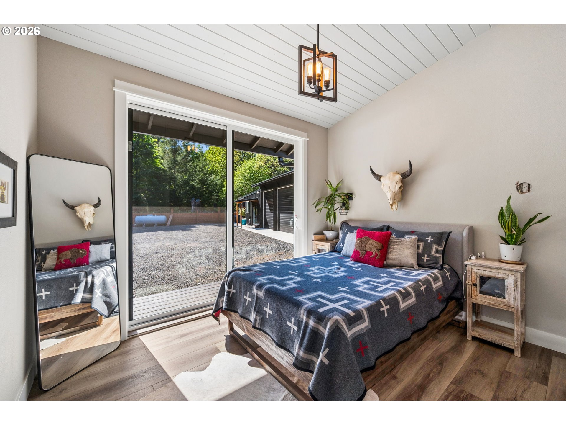 18600 Northwest Meadowlake Road Yamhill, OR 97148 - Photo 25 of 47 a bedroom with a bed and a large window