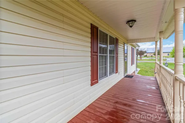 a view of a pathway with a wooden fence
